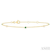 1.75 MM Emerald and 1/20 Ctw Round Cut Diamond Precious Station Bracelet in 14K Yellow Gold