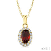 5x3 MM Oval Shape Garnet and 1/20 Ctw Round Cut Diamond Halo Semi-Precious Pendant with Chain in 14K Yellow Gold