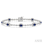 5x3 MM Oval Cut Sapphire and 1/20 Ctw Round Cut Diamond Bracelet in 10K White Gold