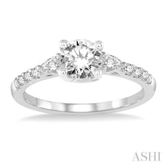 7/8 ctw Pear and Round Cut Diamond Engagement Ring With 1/2 ct Round Cut Center Stone in 14K White Gold