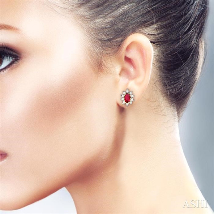 5x3MM Oval Cut Ruby and 1/4 ctw Round Cut Diamond Earrings in 14K Yellow Gold