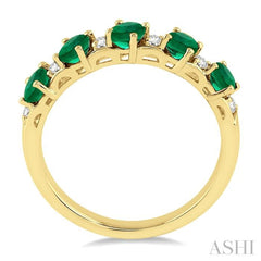 4x3 MM Oval Shape Emerald and 1/6 ctw Round Cut Diamond Precious Band in 14K Yellow Gold