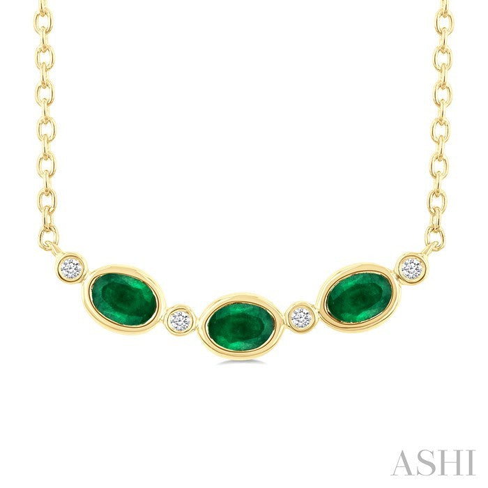 4X3 MM Oval Cut Emerald and 1/50 Ctw Bezel Set Round Cut Diamond Precious Fashion Necklace in 10K Yellow Gold