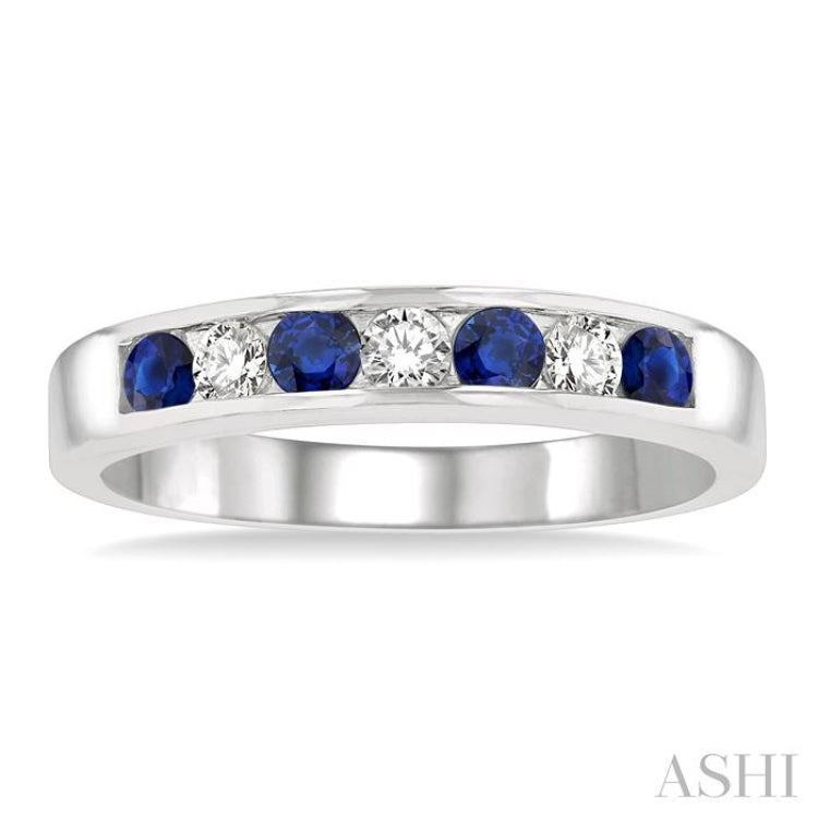 2.5 MM Round Cut Sapphire and 1/5 Ctw Channel Set Round Cut Diamond Band in 14K White Gold
