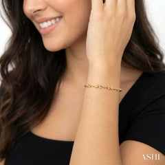 1/4 Ctw Leaf Accent Wavy Link Round Cut Diamond Fashion Bracelet in 10K Yellow Gold
