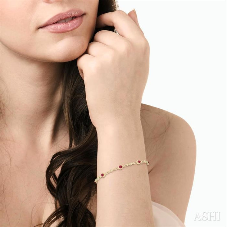 4X3 MM Pear Cut Ruby and 1/20 Ctw Round Cut Diamond Precious Fashion Bracelet in 10K Yellow Gold